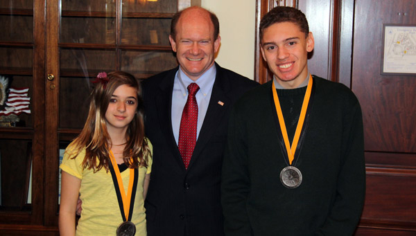 Photo of Senator Coons with Spirit of Community award winners